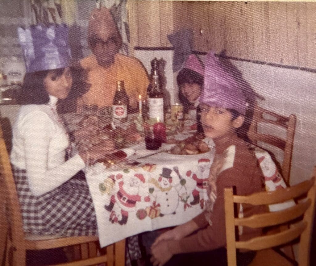Four members of an Indo-Caribbean family enjoying Christmas dinner