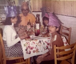 Four members of an Indo-Caribbean family enjoying Christmas dinner