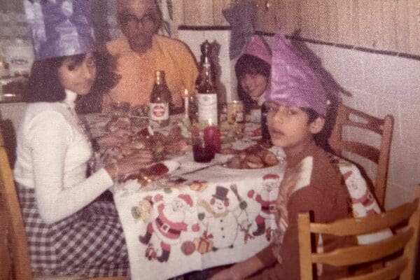 Four members of an Indo-Caribbean family enjoying Christmas dinner
