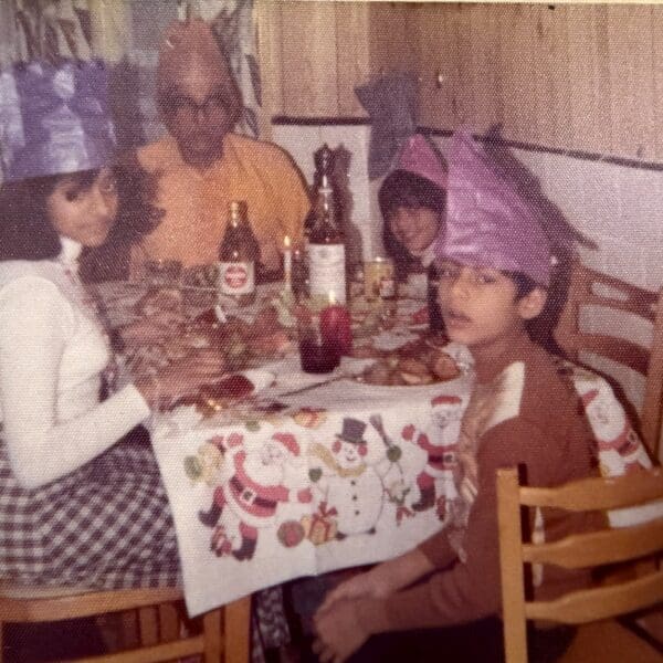 Four members of an Indo-Caribbean family enjoying Christmas dinner