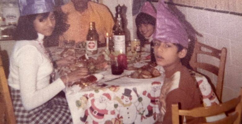 Four members of an Indo-Caribbean family enjoying Christmas dinner